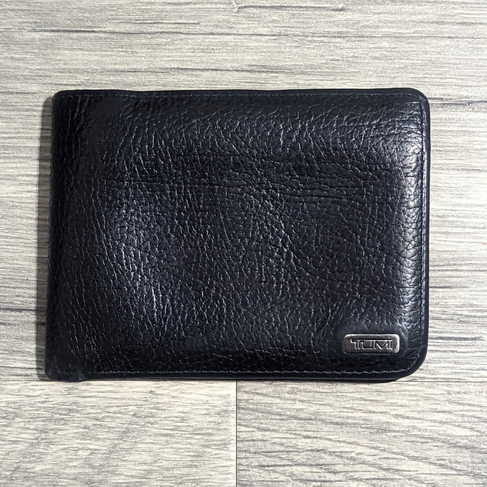 Tumi black pebbled billfold.